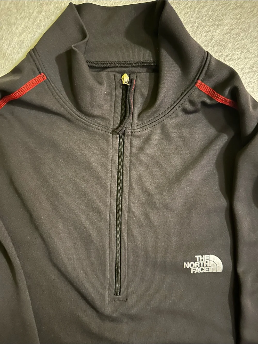 The North Face Men’s Black Half-Zip Performance Jacket with Red Accents